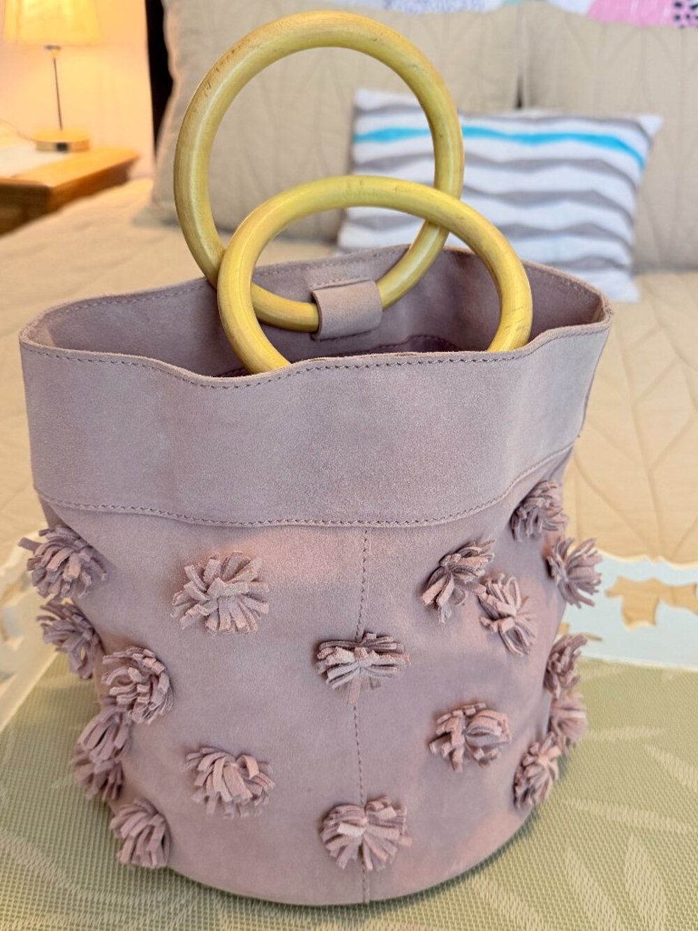 Anthropologie Blush Pink Starburst Pom Pom Suede Bucket Bag Wooden Handles